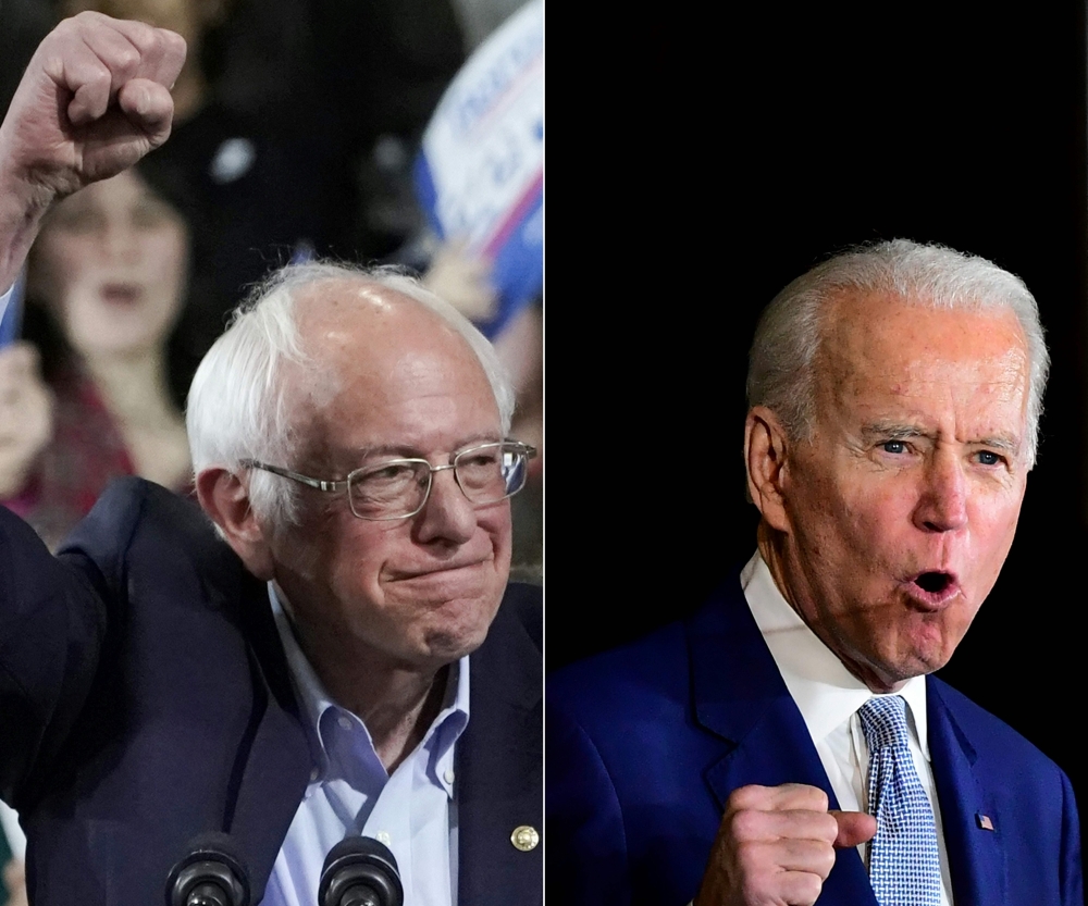 Bernie Sanders and Joe Biden speaking during a Super Tuesday event in Los Angeles on March 3, 2020. AFP / Timothy A Clary & Frederic J Brown