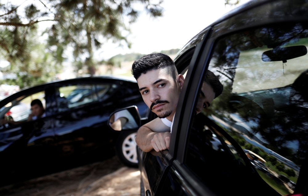 Uber drivers sit in their cars as they wait for passengers in Sao Paulo, Brazil, February 13, 2017. Reuters / Nacho Doce
 
 