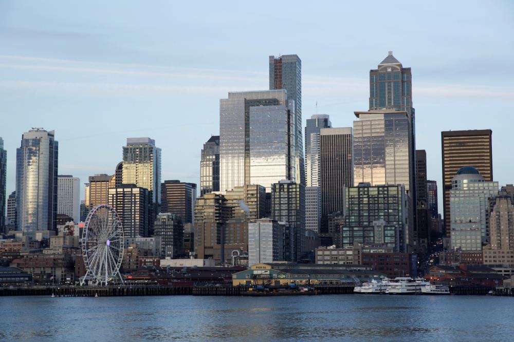  The Seattle skyline is pictured from a Washington State Ferry following a statement from ferry officials asking riders to consider staying in their vehicles when driving onboard and other steps to minimize coronavirus exposure in Seattle, Washington, U.S