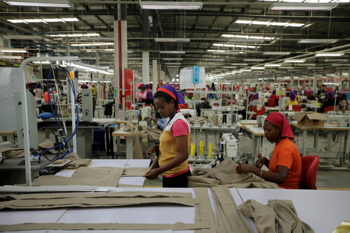 Workers arrange pieces of fabric inside the Indochine Apparel PLC textile factory in Ethiopia November 17, 2017. Reuters / Tiksa Neger
