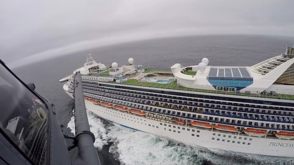 Airmen from the Moffett Federal Airfield based, 129th Rescue Wing deliver coronavirus test-kits to the Grand Princess cruise ship off the coast of California in this still image from a video on March 5, 2020. California National Guard/Handout via Reuters