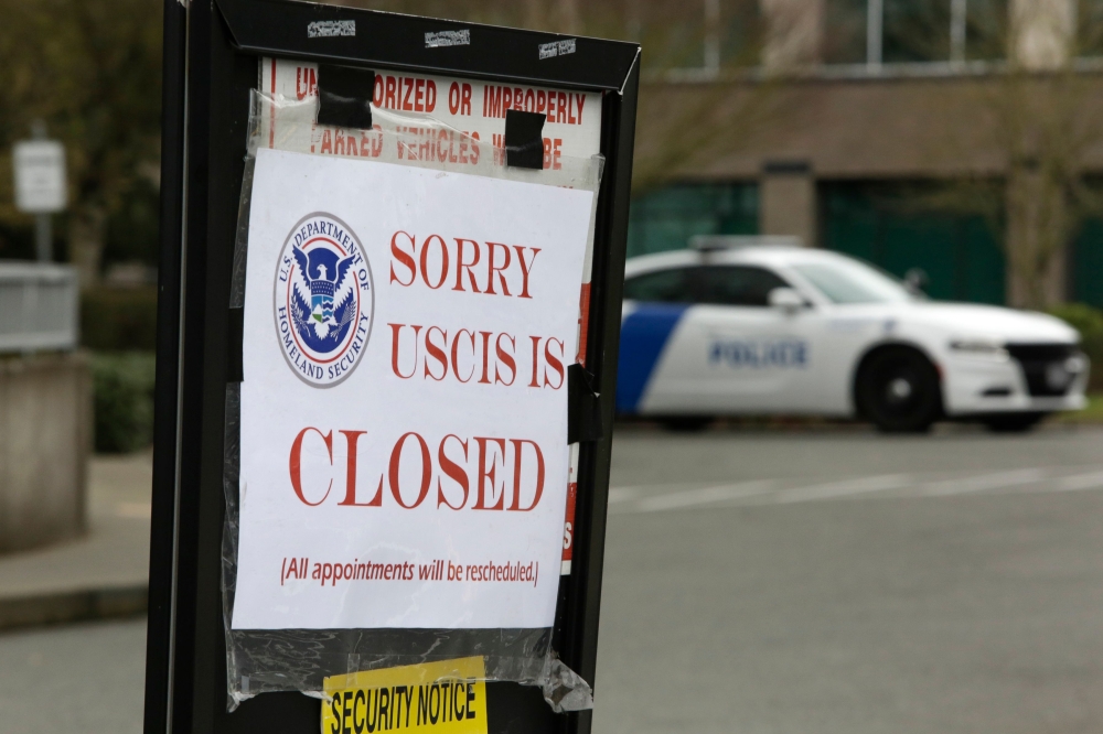 A sign indicating the office is closed is posted following a two-week closure of a Department of Homeland Security building and US Citizenship and Immigration Services field office because of an employee who may be infected with the novel coronavirus in T