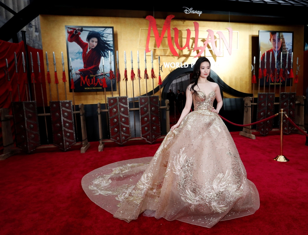 Cast member Liu Yifei poses at the premiere for the film 