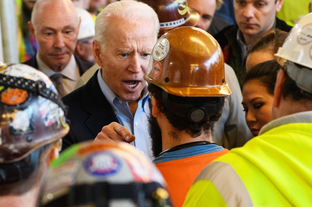 Democratic presidential candidate Joe Biden meets workers as he tours the Fiat Chrysler plant in Detroit, Michigan on March 10, 2020. AFP / Mandel Ngan 