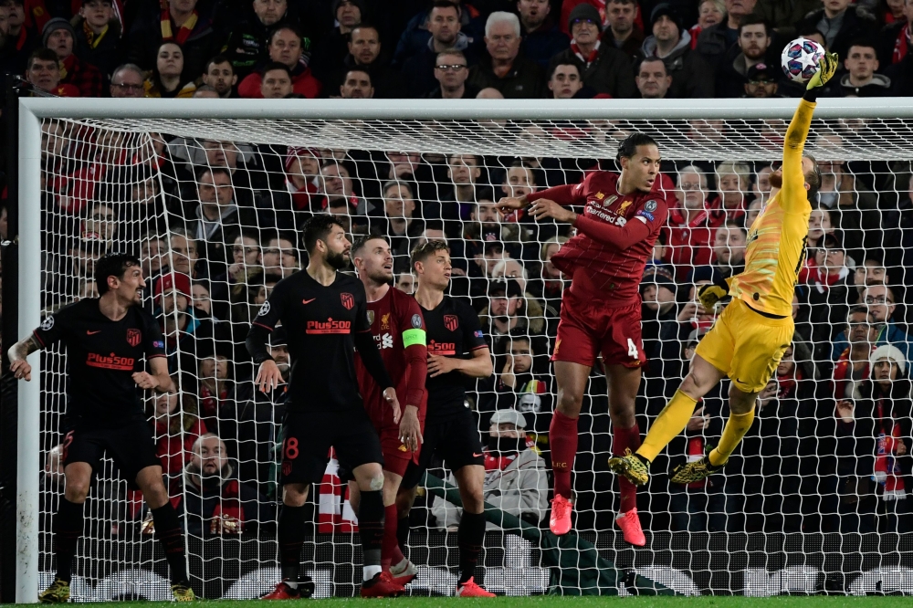 Atletico Madrid's Slovenian goalkeeper Jan Oblak clears the ball during the UEFA Champions league Round of 16 second leg football match between Liverpool and Atletico Madrid at Anfield in Liverpool, north west England on March 11, 2020. / AFP / JAVIER SOR