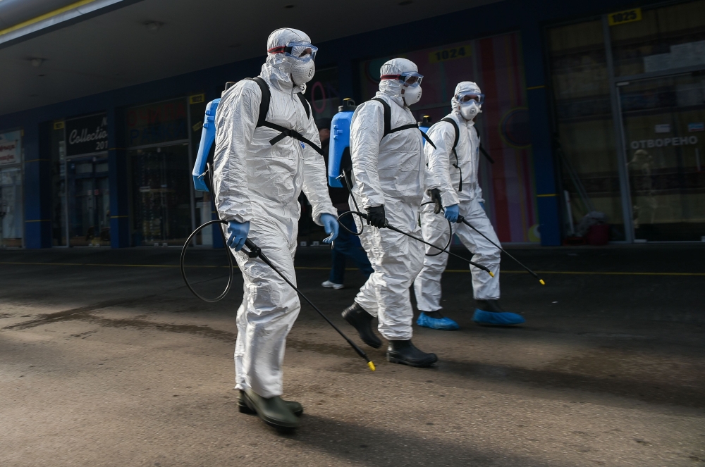  Members of Sofia's Municipality disinfects the biggest market for Chinese goods in Sofia to prevent the spread of the COVID-19, the novel coronavirus, on March 12, 2020. / AFP / NIKOLAY DOYCHINOV