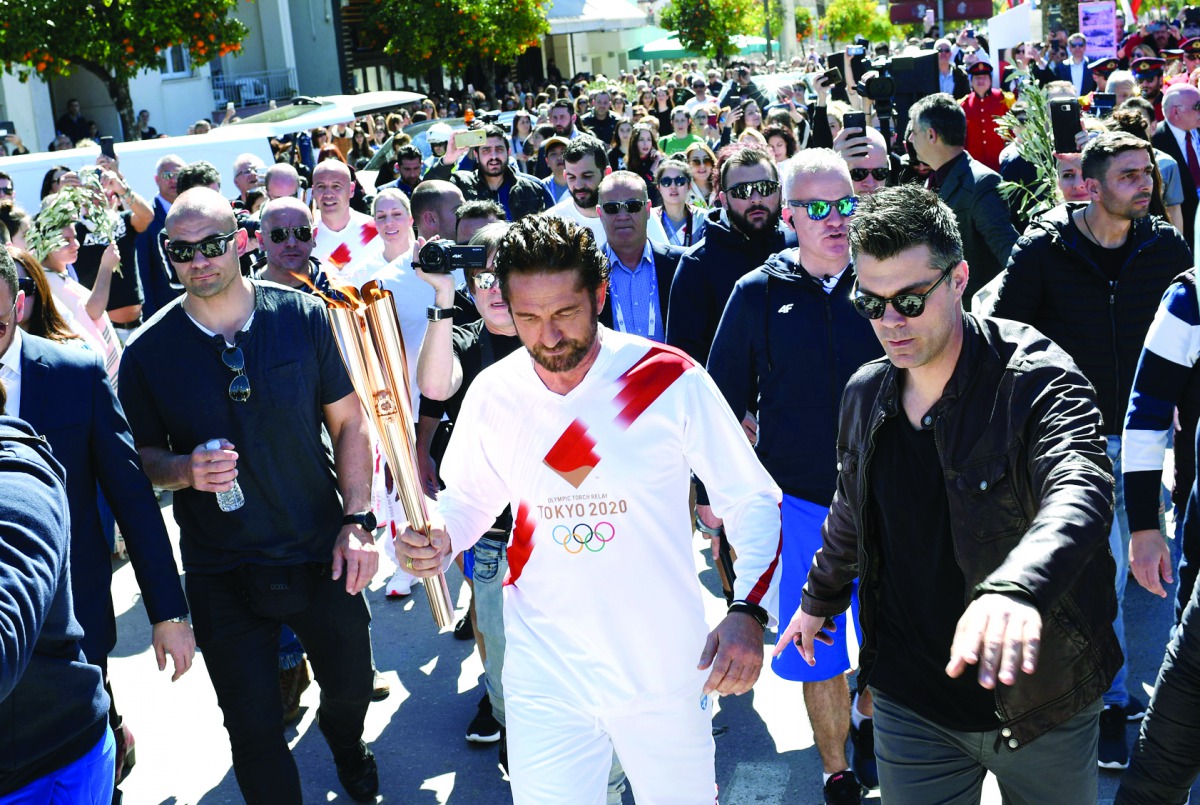 US actor Gerard Butler takes part in the Olympic flame torch relay for the Tokyo 2020 Summer Olympics, Sparta, Greece, March 13, 2020 Reuters/Vassilis Psomas