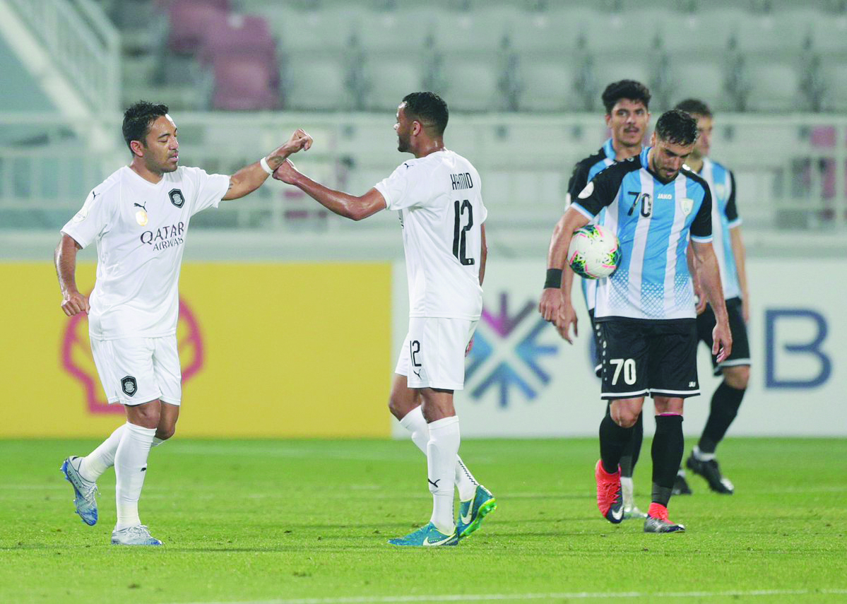 Al Sadd's Marco Fabian (left) celebrates with a team-mate after scoring a goal against Al Wakrah during yesterday's Amir Cup quarter-final at the Abdullah Bin Khalifa Stadium.