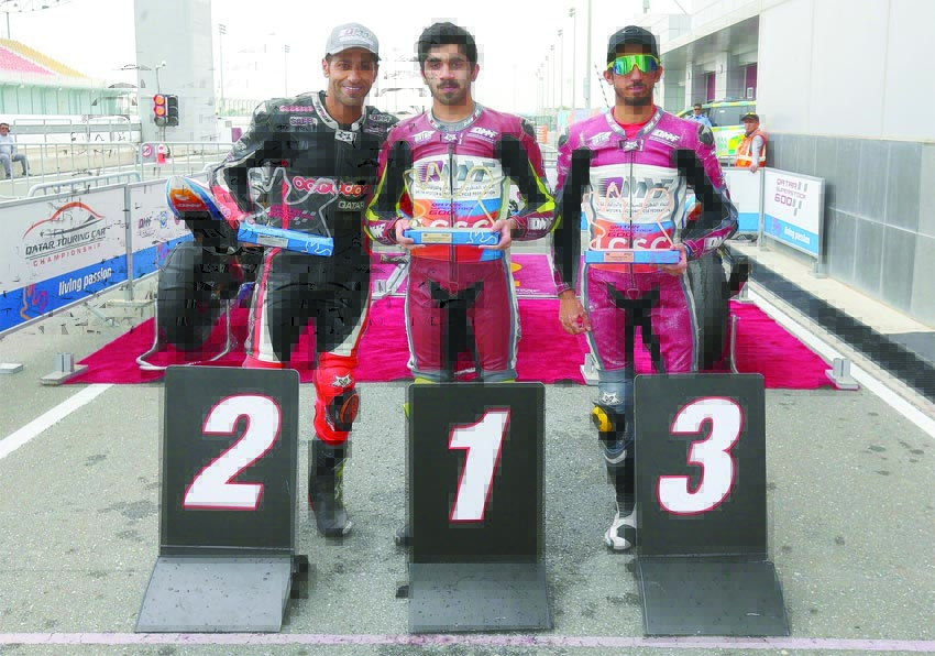 Abdulla Al Qubaisi (centre), Saeed Al Sulaiti (right) and Mashel Al Naimi pose with their trophies.