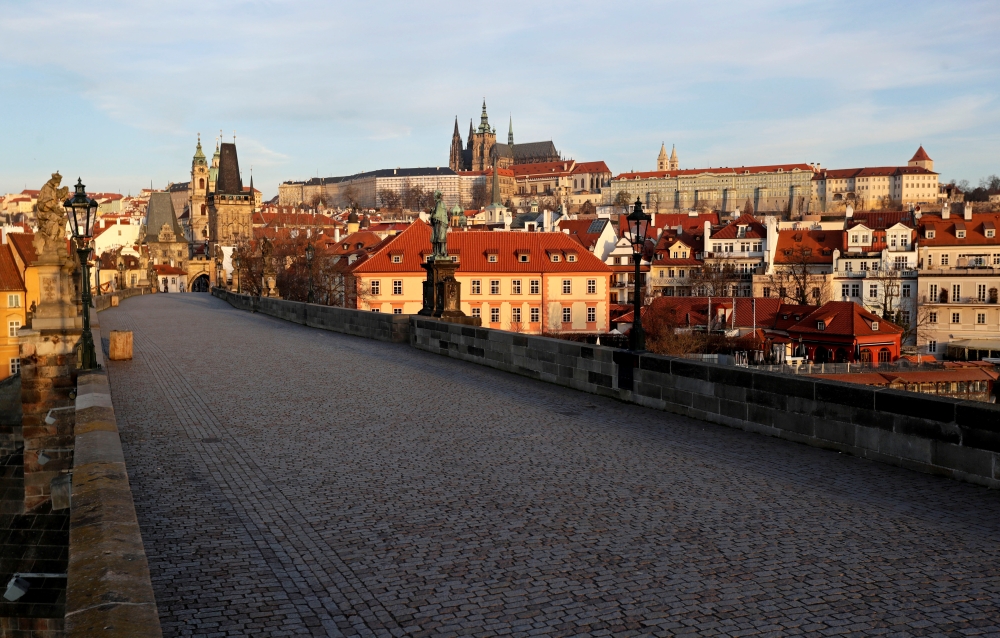 FILE PHOTO: An empty medieval Charles Bridge is seen in Prague, as the Czech government restricts movement of people to slow the spread of the new coronavirus disease (COVID-19), Czech Republic, March 16, 2020. REUTERS/David W Cerny/File Photo