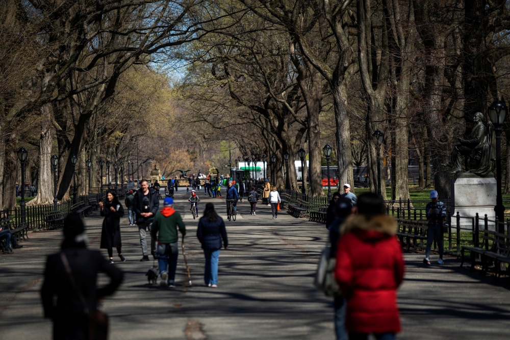 People enjoy the day at Central Park as the coronavirus disease (COVID-19) outbreak continues in New York, U.S., March 21, 2020. REUTERS/Eduardo Munoz