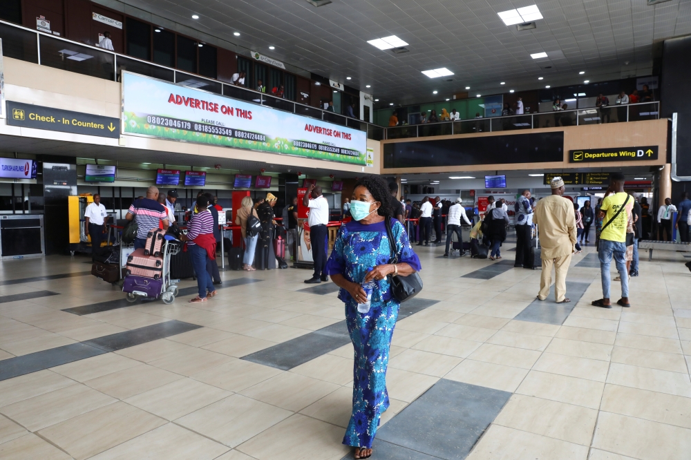 A woman wears a protective face mask due to the spread of the coronavirus disease (COVID-19), at the Murtala Mohammed International airport in Lagos, Nigeria March 19, 2020. Picture taken March 19, 2020. REUTERS/Temilade Adelaja
