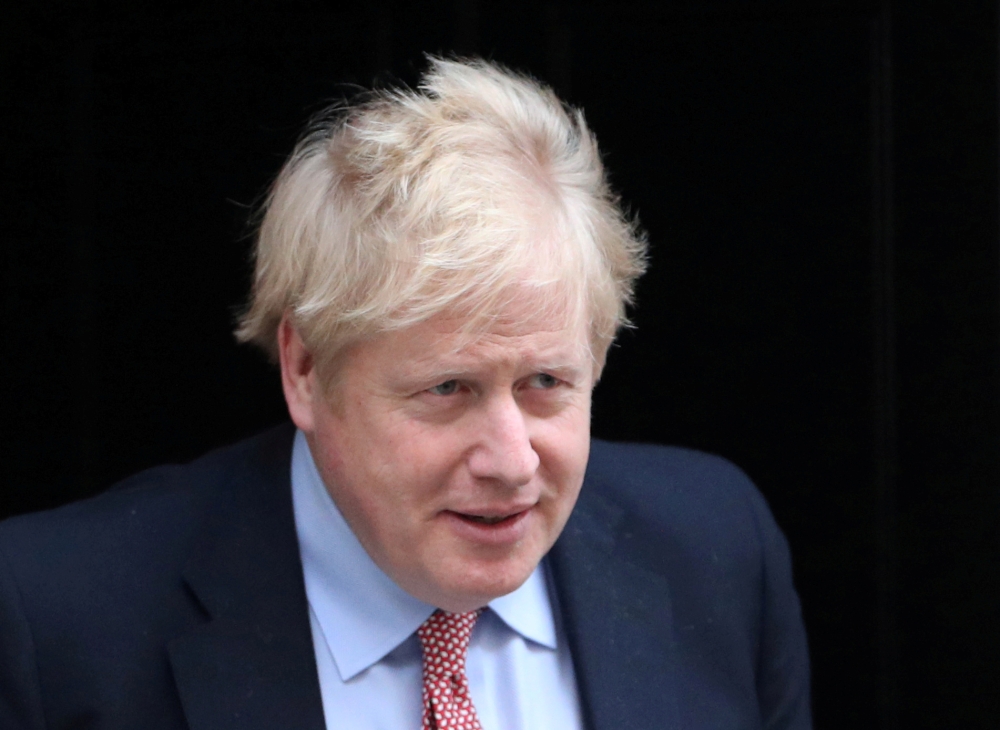 FILE PHOTO: Britain's Prime Minister boris Johnson leaves Downing Street, as the spread of coronavirus disease (COVID-19) continues. London, Britain, March 25, 2020. REUTERS/Hannah Mckay/File Photo
