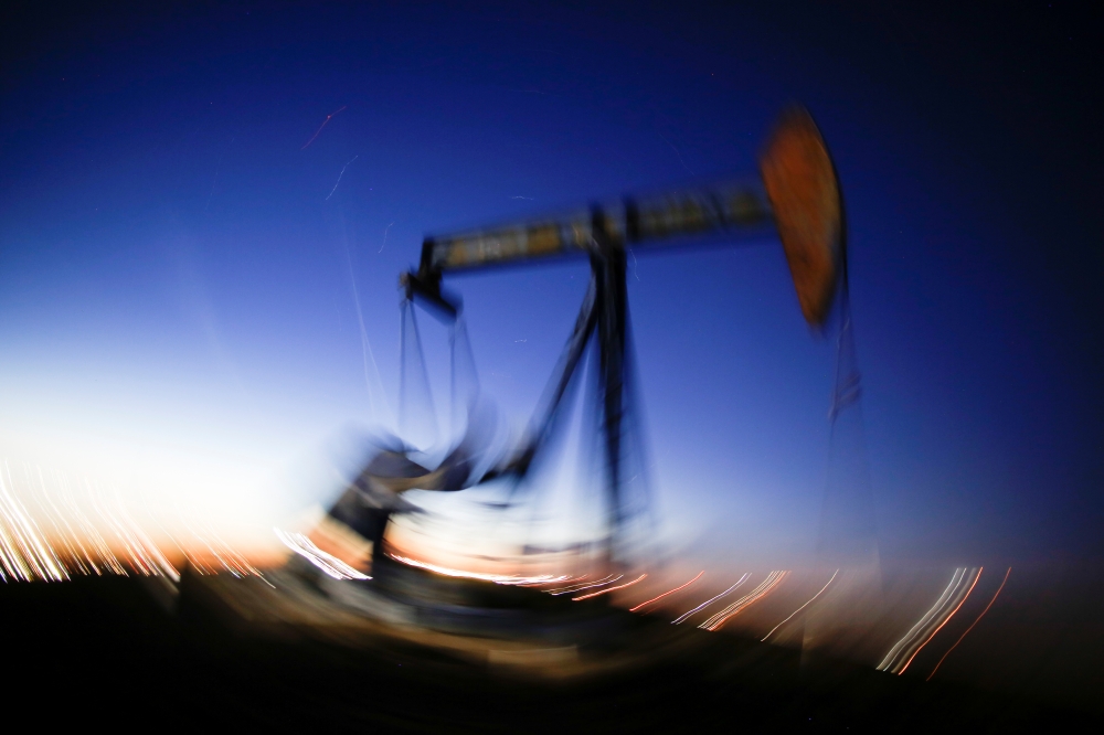 A long exposure image shows the movement of a crude oil pump jack in the Permian Basin in Loving County, Texas, November 23, 2019. Reuters / Angus Mordant