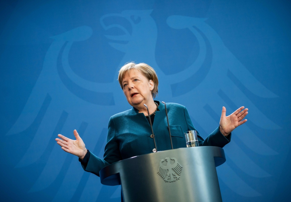 German Chancellor Angela Merkel makes a press statement on the spread of the new coronavirus COVID-19 at the Chancellery in Berlin. / AFP / POOL / Michael Kappeler