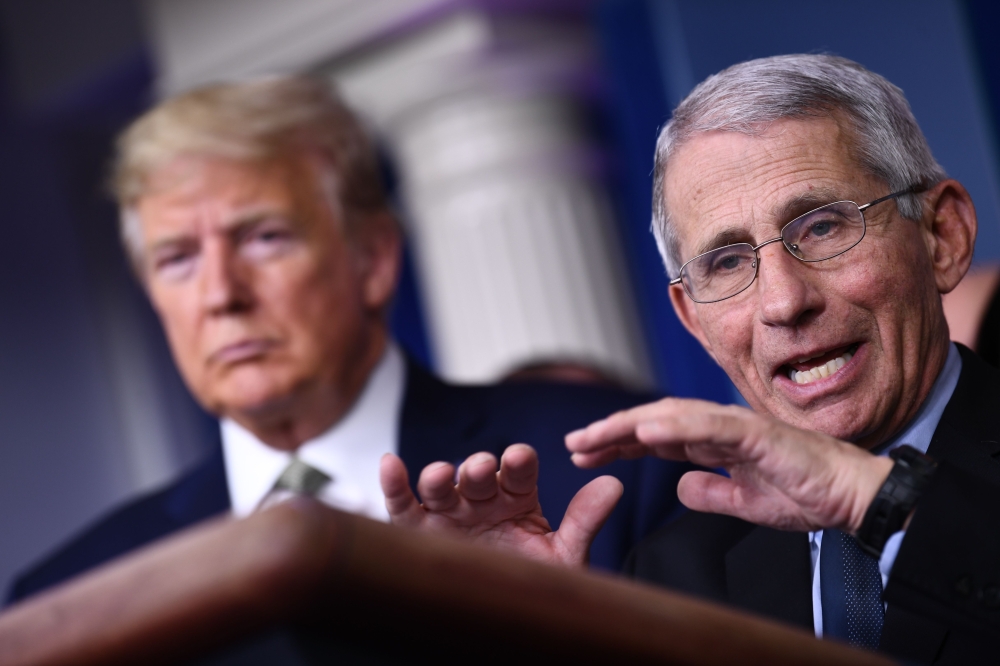 (FILES) In this file photo Dr. Anthony Fauci speaks as US President Donald Trump listens during the daily press briefing on the Coronavirus pandemic situation at the White House on March 17, 2020 in Washington, DC. AFP / Brendan Smialowski