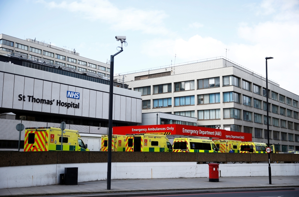 Ambulances are seen outside St Thomas' hospital, as the spread of the coronavirus disease (COVID-19) continues, London, Britain, March 29, 2020. REUTERS/Henry Nicholls