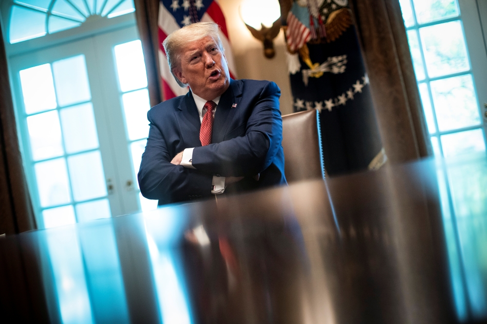U.S. President Donald trump speaks during a meeting with supply chain distributors in the Cabinet Room of the White House in Washington, U.S., March 29, 2020. REUTERS/Al Drago