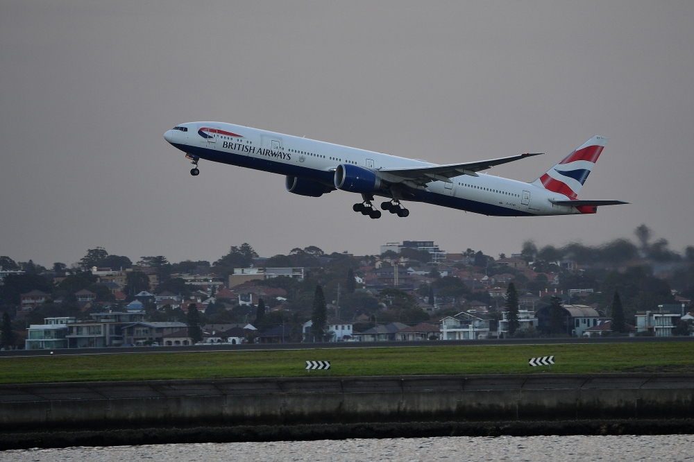 A British Airways flight takes off from Sydney International Airport in Sydney on March 27, 2020. AFP / Saeed Khan 