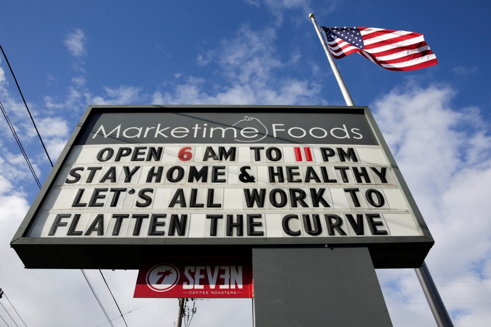 A neighborhood market marquee reads 