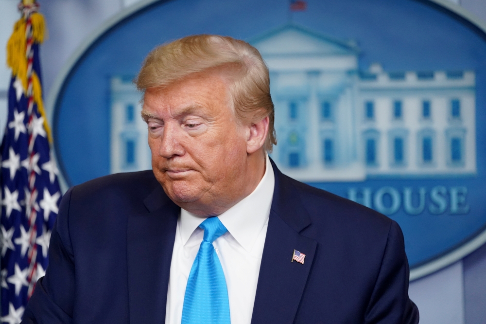U.S. President Donald Trump pauses as he addresses the daily coronavirus task force briefing at the White House in Washington, U.S., April 7, 2020. REUTERS/Kevin Lamarque
