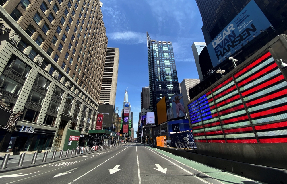 :A nearly deserted 7th Avenue in Times Square is seen near midday in Manhattan during the outbreak of the coronavirus disease (COVID-19) in New York City, New York, U.S., April 7, 2020. REUTERS/Mike Segar
