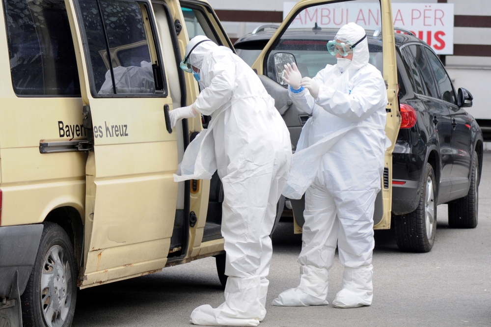 Medical workers in protective suits are pictured at University Clinical Center of Kosovo in Pristina, Kosovo, April 15, 2020. REUTERS/Laura Hasani