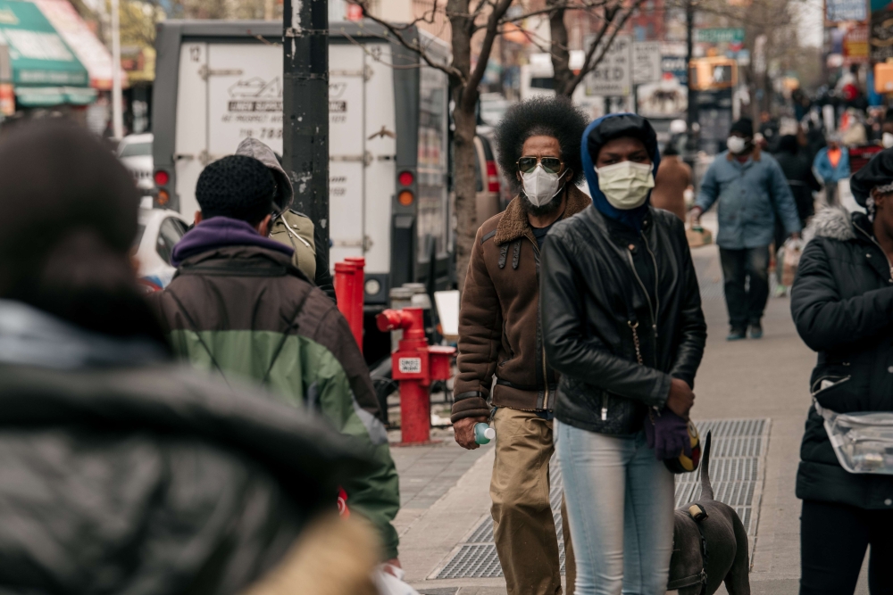 Pedestrians wear face masks on Fulton Street on April 17, 2020 in the Brooklyn borough of New York City. (Scott Heins/Getty Images/AFP)