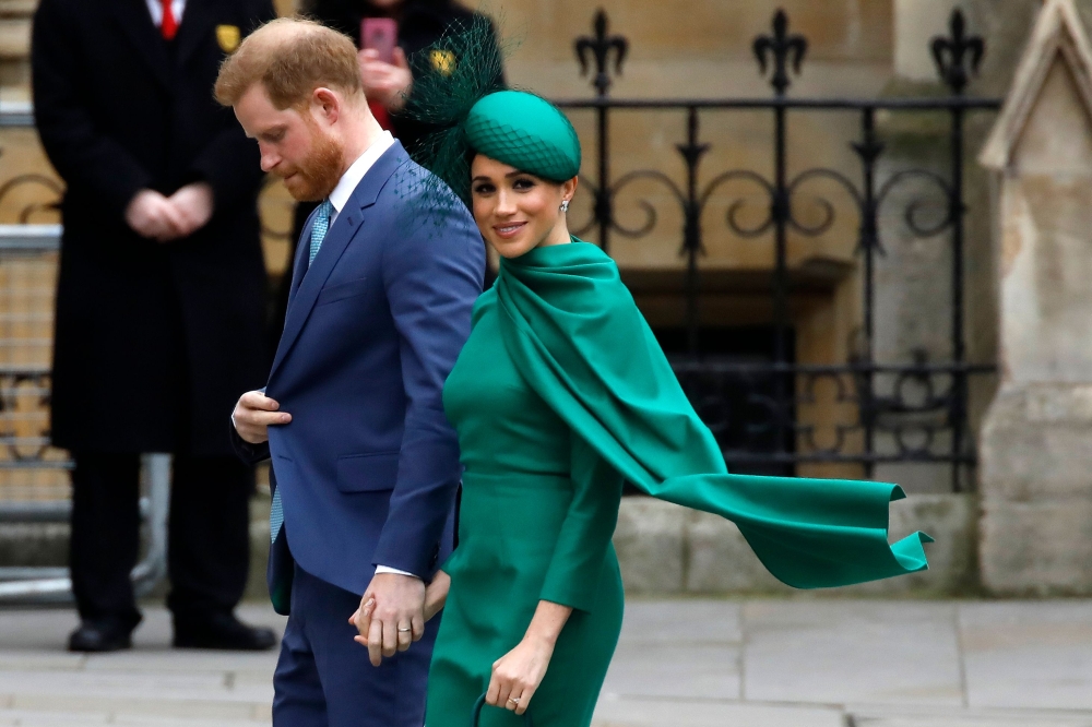 (FILES) In this file photo taken on March 9, 2020 Britain's Prince Harry, Duke of Sussex, (L) and Meghan, Duchess of Sussex arrive to attend the annual Commonwealth Service at Westminster Abbey in London. AFP / Tolga Akmen 