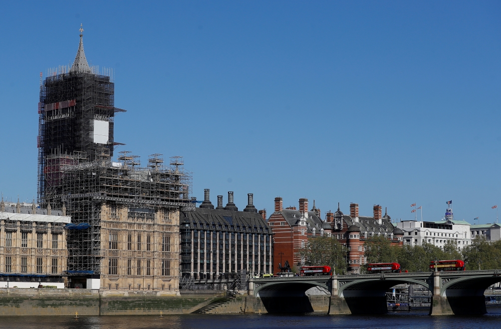 The Houses of Parliament and Big Ben are seen by Westminster bridge from across the River Thames ahead of Parliament reopening while the spread of the coronavirus disease (COVID-19) continues, London, Britain, April 21, 2020. REUTERS/Peter Nicholls
