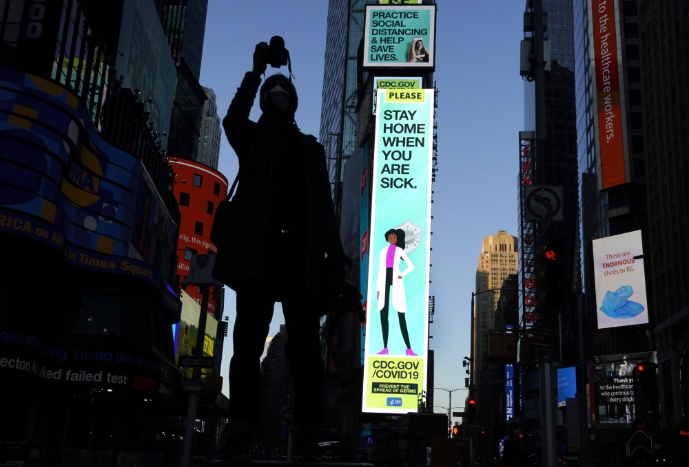 :Some of the nearly 1,800 digital billboards and screens across all five boroughs are displaying messages of public safety, gratitude, pride, and solidarity with essential workers as seen in Times Square April 19, 2020 in New York. / AFP / TIMOTHY A. CLAR