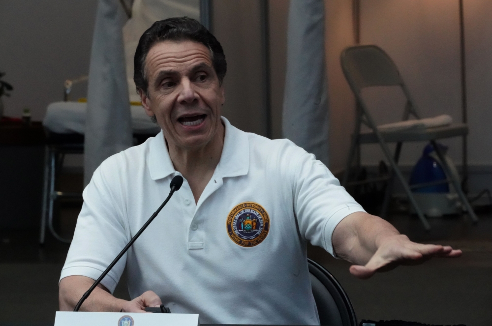 (FILES) In this file photo taken on March 27, 2020 New York Governor Andrew Cuomo speaks to the press at the Jacob K. Javits Convention Center in New York. / AFP / Bryan R. Smith