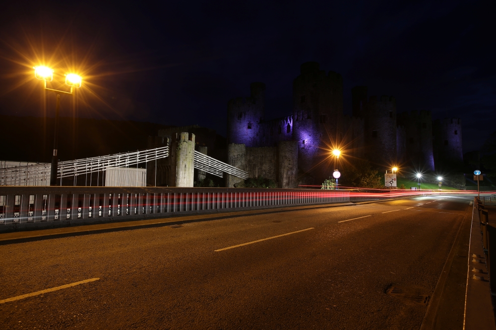 General view of the Conwy Castle, lit up with blue lights in support of the NHS, as the spread of the coronavirus disease (COVID-19) continues, in Conwy, Britain April 24, 2020. Picture taken with long exposure. REUTERS/Molly Darlington
