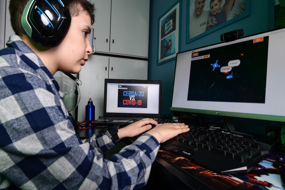 Fourth grade pupil 9-year-old boy Lupo Daturi displays 