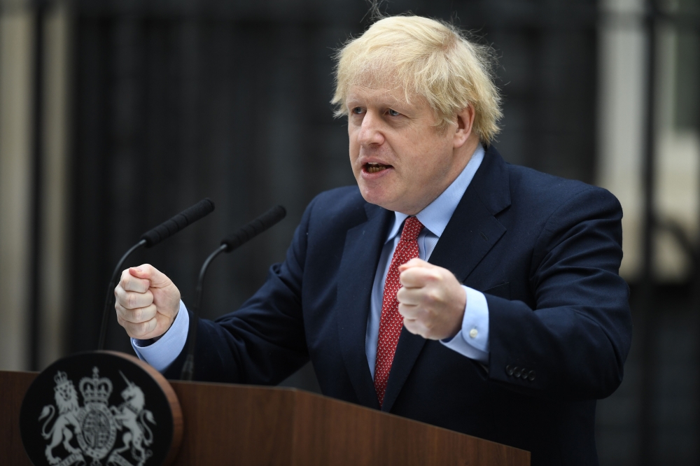 Britain's Prime Minister Boris Johnson gives a statement in Downing Street in central London on April 27, 2020 after returning to work following more than three weeks off after being hospitalised with the COVID-19 illness.  / AFP / DANIEL LEAL-OLIVAS