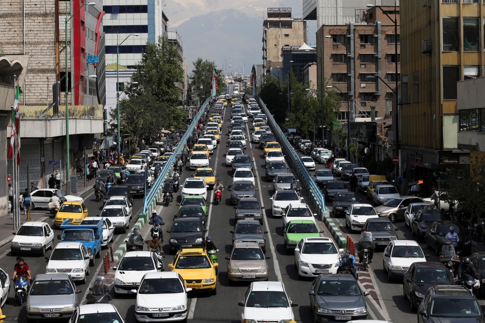 FILE PHOTO: A general view of traffic, following the outbreak of the coronavirus disease (COVID-19), after shopping malls and bazaars reopened in Tehran, Iran, April 20, 2020. WANA (West Asia News Agency)/Ali Khara via Reuters