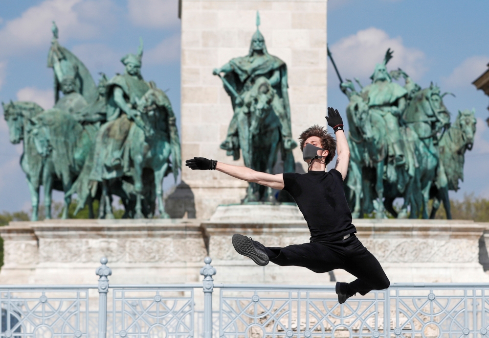 Hungarian ballet dancer Zsolt Kovacs performs a choreographic piece he has designed for the 'coronavirus melody', a musical composition created by MIT scientists from a model of the protein structure of SARS-CoV-2, during the coronavirus disease (COVID-19