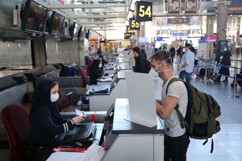 Turkish citizens arrive at Tehran Imam Khomeini International Airport for the evacuation flight of Turkey's national carrier Turkish Airlines amid the coronavirus (COVID-19) pandemic in Tehran, Iran on April 27, 2020. Fatemeh Bahrami - Anadolu 
