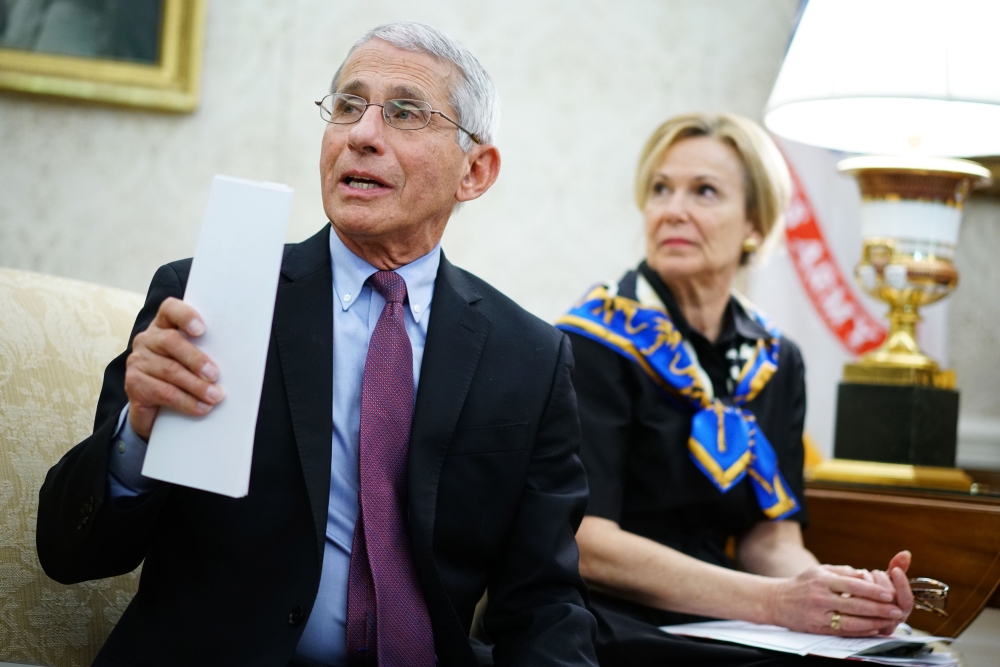 Dr. Anthony Fauci (L), director of the National Institute of Allergy and Infectious Diseases speaks next to Response coordinator for White House Coronavirus Task Force Deborah Birx, during a meeting with US President Donald Trump and Louisiana Governor Jo