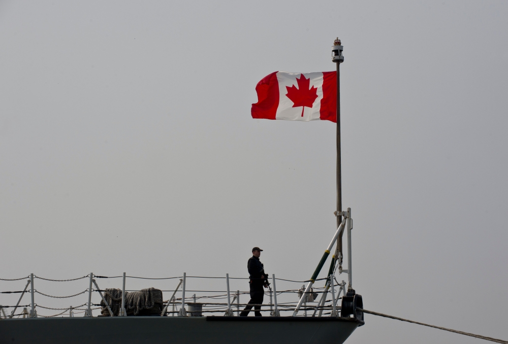 (FILES) This file photograph taken on March 13, 2015, shows a Canadian soldier as he stands on board frigate HMCS Fredericton docked at Constanta Harbour in Constanta, Romania.   / AFP / Daniel MIHAILESCU