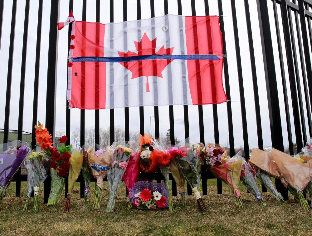FILE PHOTO: A memorial for Const. Heidi Stevenson is seen outside the Royal Canadian Mounted Police (RCMP) Headquarters, in Dartmouth, Nova Scotia, Canada April 20, 2020. REUTERS/John Morris/File Photo