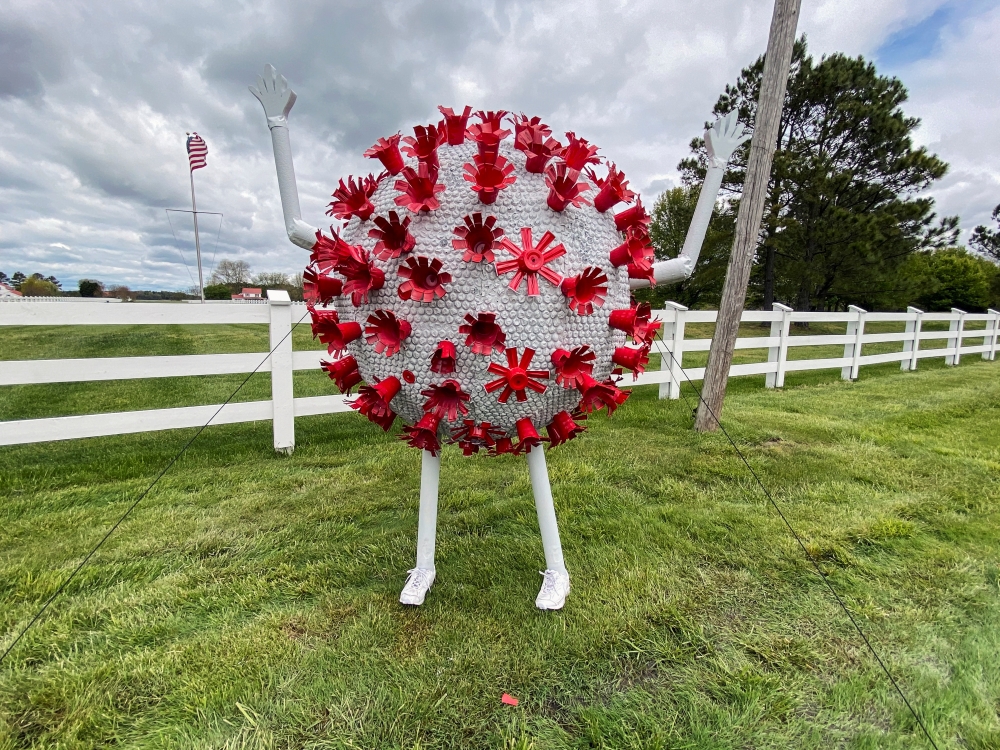 A sculpture in the likeness of a coronavirus particle is seen outside a property that borders a road leading to St. Michaels, Maryland, amid the coronavirus disease (COVID-19) outbreak in the U.S., April 27, 2020. REUTERS/Katharine Jackson 