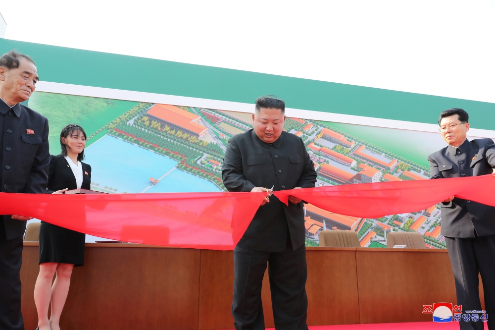 North Korean leader Kim Jong Un attends the completion of a fertiliser plant, together with his younger sister Kim Yo Jong, in a region north of the capital, Pyongyang, in this image released by North Korea's Korean Central News Agency (KCNA) on May 2, 20