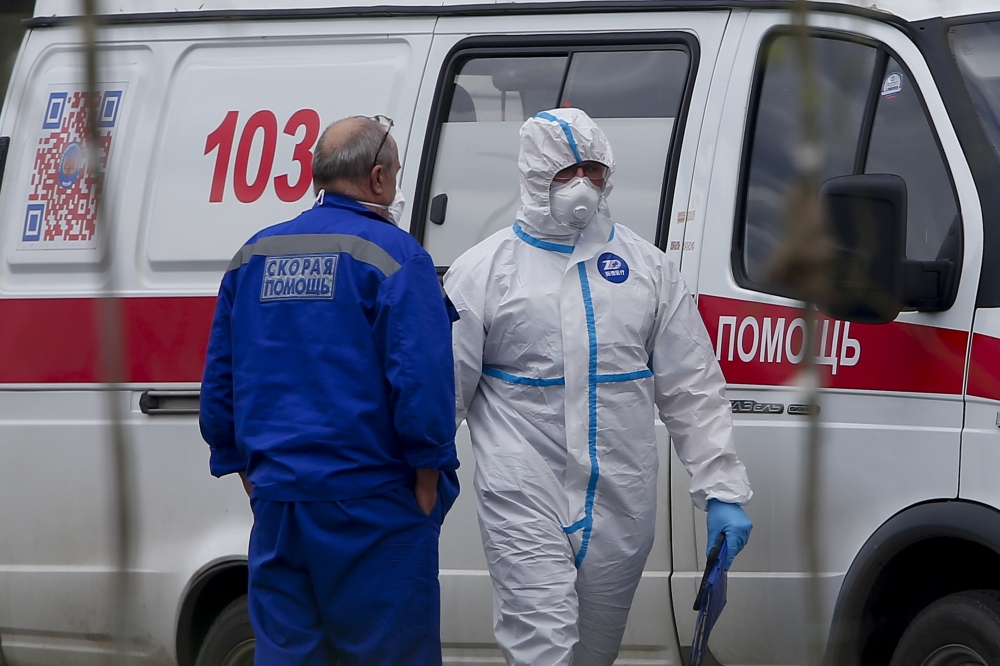 MOSCOW, RUSSIA - MAY 7: Patients suspected of the coronavirus (COVID-19) infection are being brought to Kommunarka Hospital with an ambulance accompanied by health officials wearing protective suits in Moscow, Russia on May 7, 2020. ( Sefa Karacan - Anado