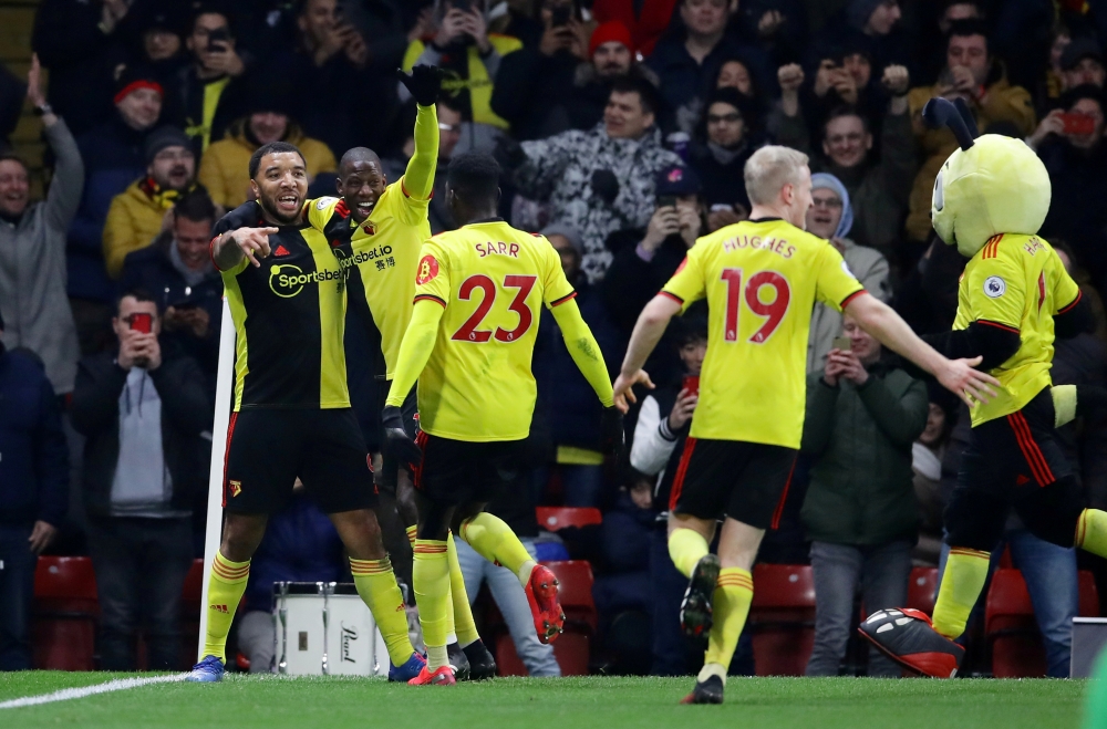Watford's Troy Deeney celebrates scoring their third goal with teammates REUTERS/David Klein EDITORIAL
