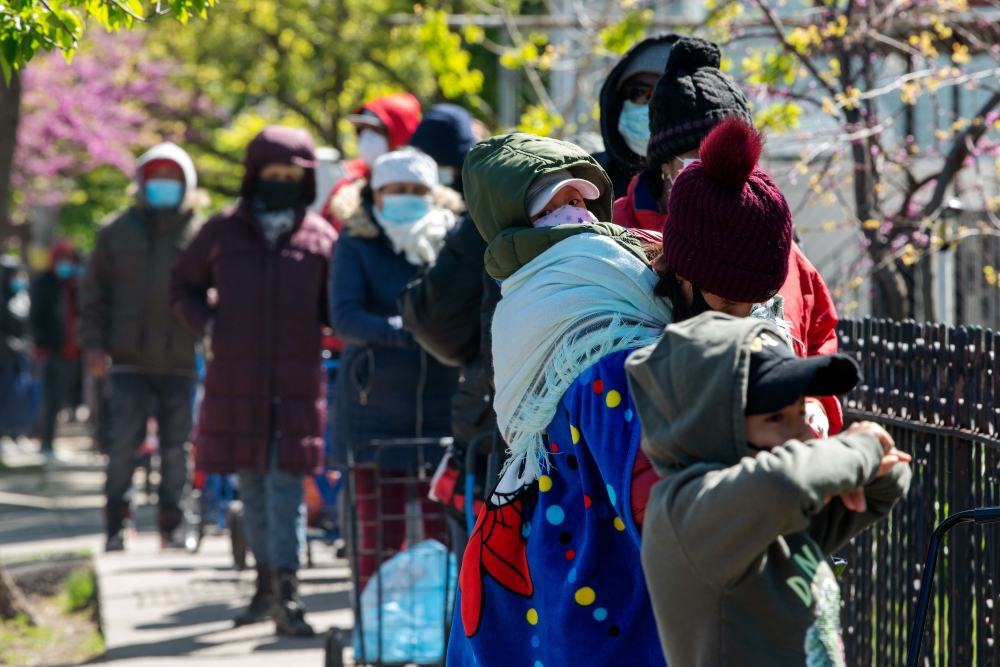 Recipients of the nonprofit organization The River Fund wait in line to receive free groceries on May 9, 2020 in the Queens borough of New York City. (Bryan Thomas/Getty Images/AFP)