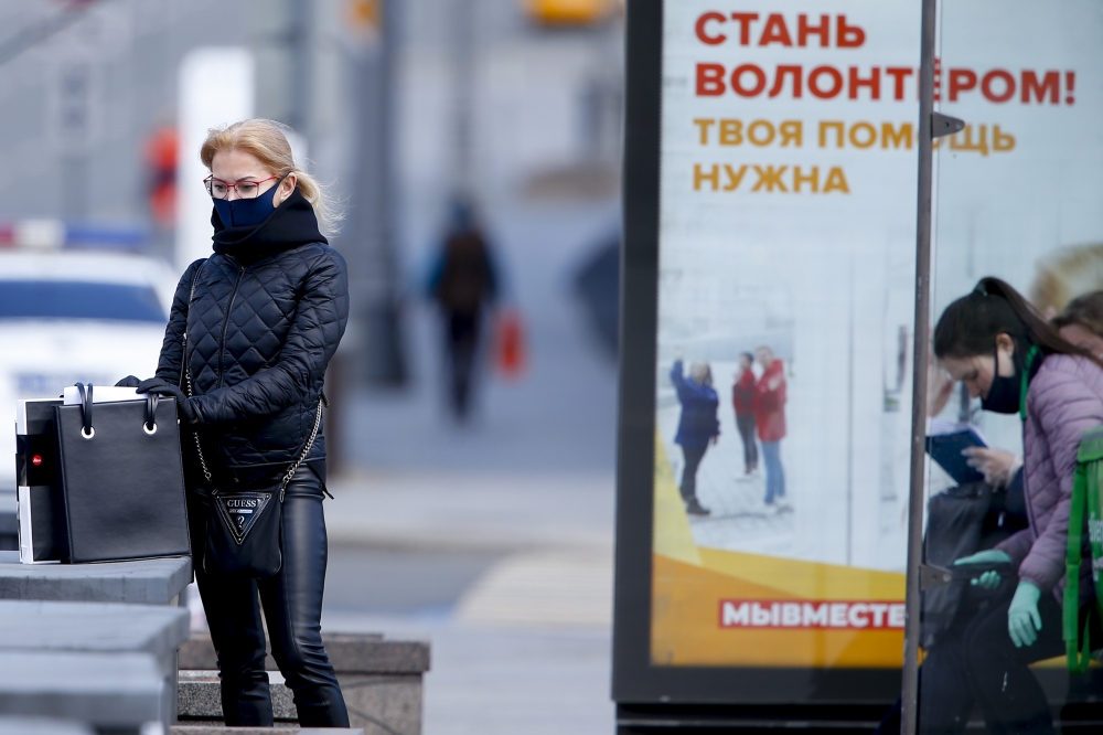 A masked woman is seen in Moscow, Russia on May 15, 2020. It is made compulsory to wear masks and gloves in public transport, including taxis, workplaces, markets and crowded environments.  Sefa Karacan - Anadolu
