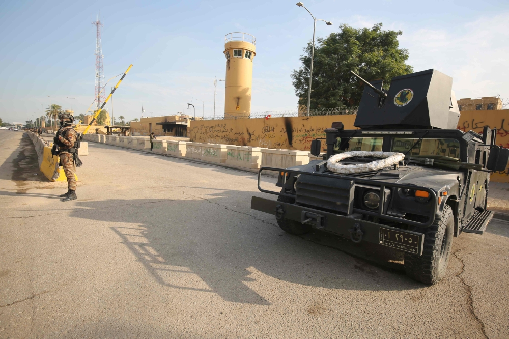  In this file photo taken on January 2, 2020 Iraqi counter-terrorism forces stand guard in front of the US embassy in the capital Baghdad. AFP / AHMAD AL-RUBAYE
