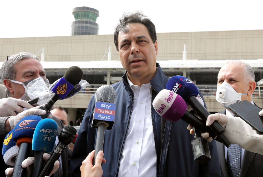 FILE PHOTO: Lebanese Prime Minister Hassan Diab speaks to the media outside Beirut's international airport, Lebanon April 5, 2020. REUTERS/Mohamed Azakir