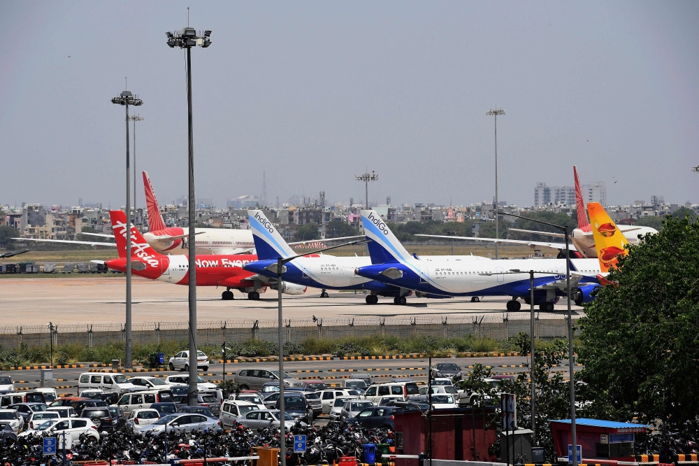 (FILES) In this file photo taken on May 8, 2020 airplanes are seen at the Indira Gandhi International airport apron during a government-imposed nationwide lockdown as a preventive measure against the COVID-19 coronavirus, in New Delhi.  / AFP / Prakash SI
